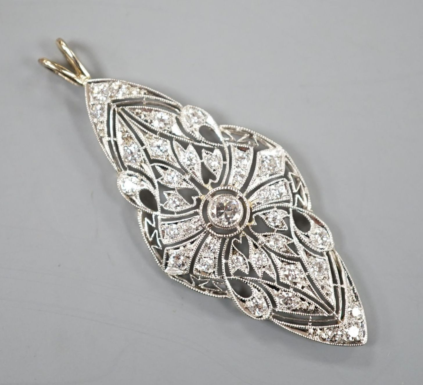 A Belle Epoque style white metal and diamond set quatrefoil shaped pendant, (adapted), 48mm, gross weight 4.4 grams.